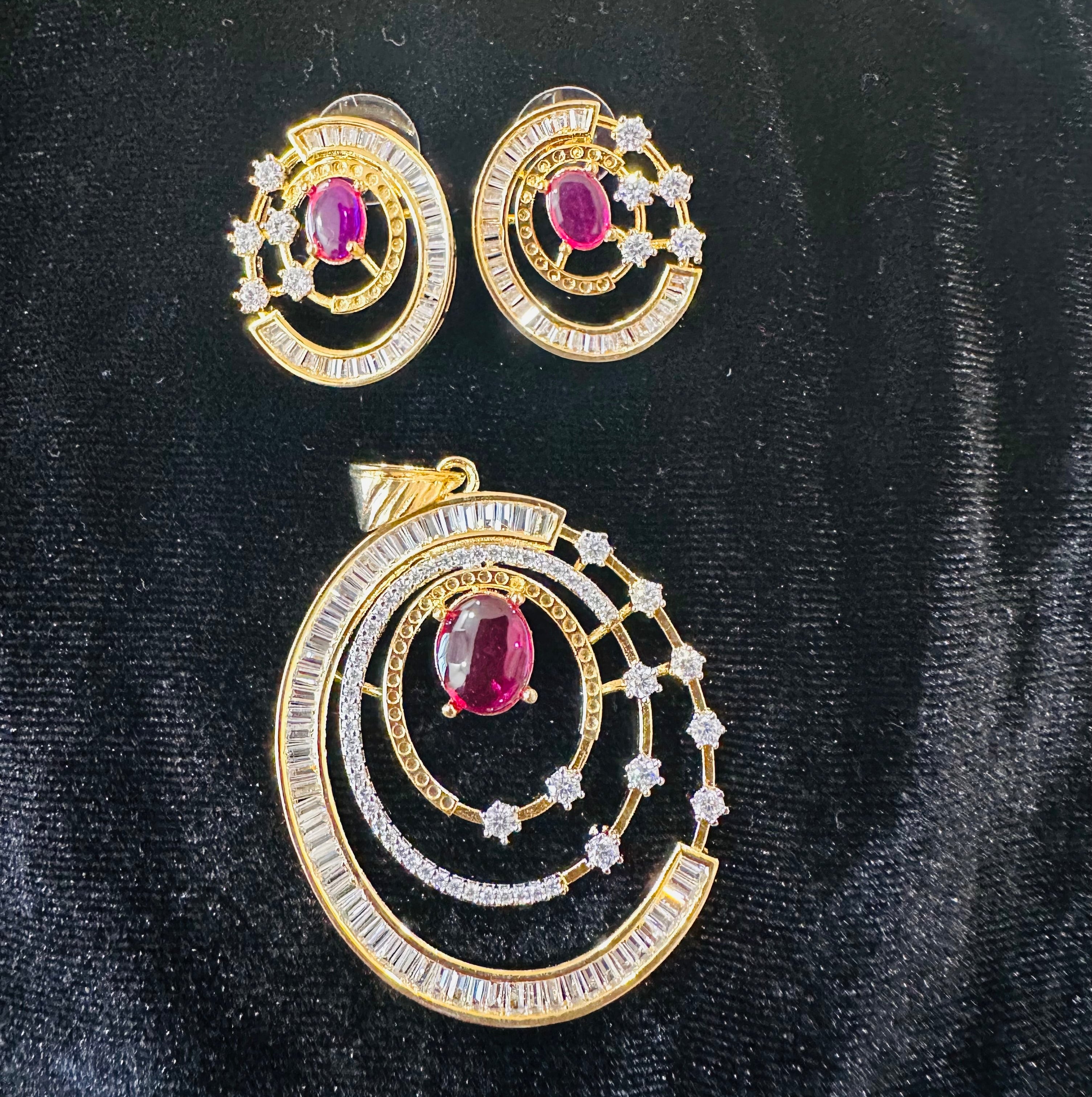The celestial ruby orbited pendent set